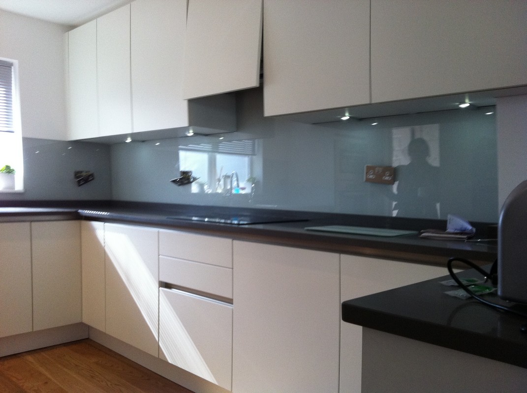 Grey glass kitchen splashback with LED lighting in Rickmansworth